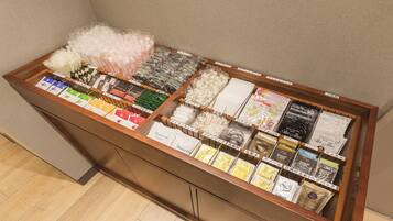 A display of various hair care products in a wooden cabinet.