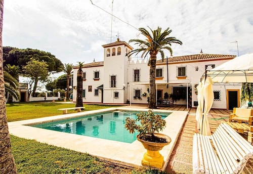 Holiday Home "Hacienda El Corchuelo en Marchena" with Pool, Garden & Wi-Fi