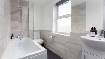Combined shower/bathtub, hair dryer