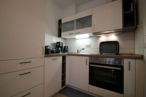 Fridge, oven, dishwasher, coffee/tea maker