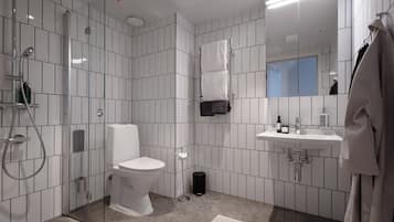 Une salle de bain moderne avec une douche à parois de verre, des toilettes, un lavabo avec un miroir et un porte-serviettes.