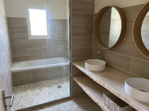 Bathtub, hair dryer, towels, soap