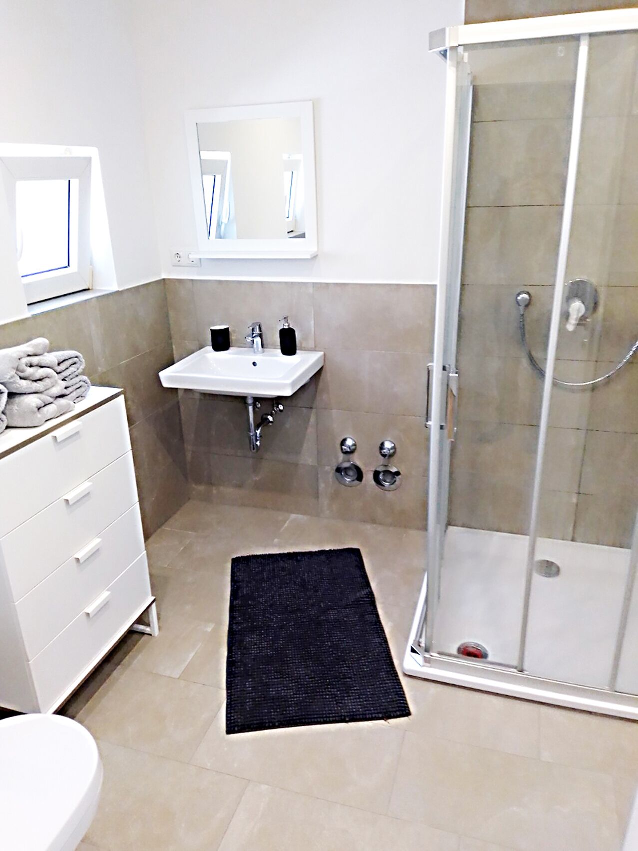 Shower, hair dryer, towels, toilet paper