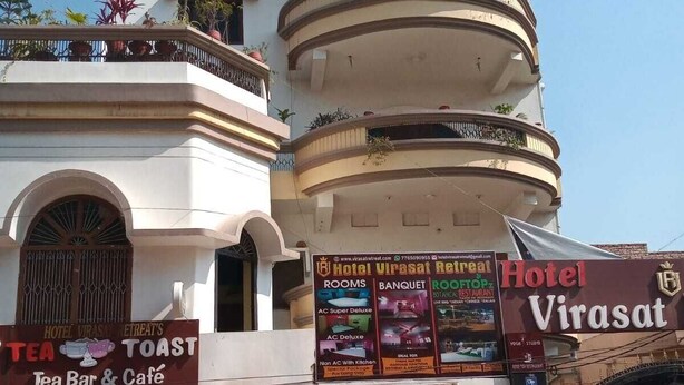 A multi-story building with a sign for 'Hotel Virasat' and a 'Tea Bar & Café' below. - 5 minutes to the JAY PRABHA MEDANTA HOSPITAL  ! Family-sized room (Patna)