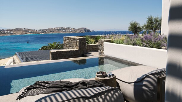 A poolside view with a clear blue sea and distant land. - Noima Boutique Hotel Mykonos (Mykonos)