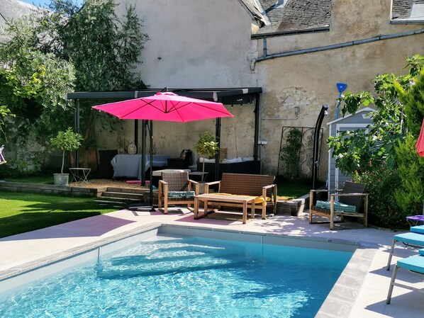 Seasonal outdoor pool, open 7:00 AM to 10:00 PM, pool umbrellas
