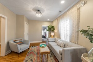 Smart TV, fireplace, books, computer monitors