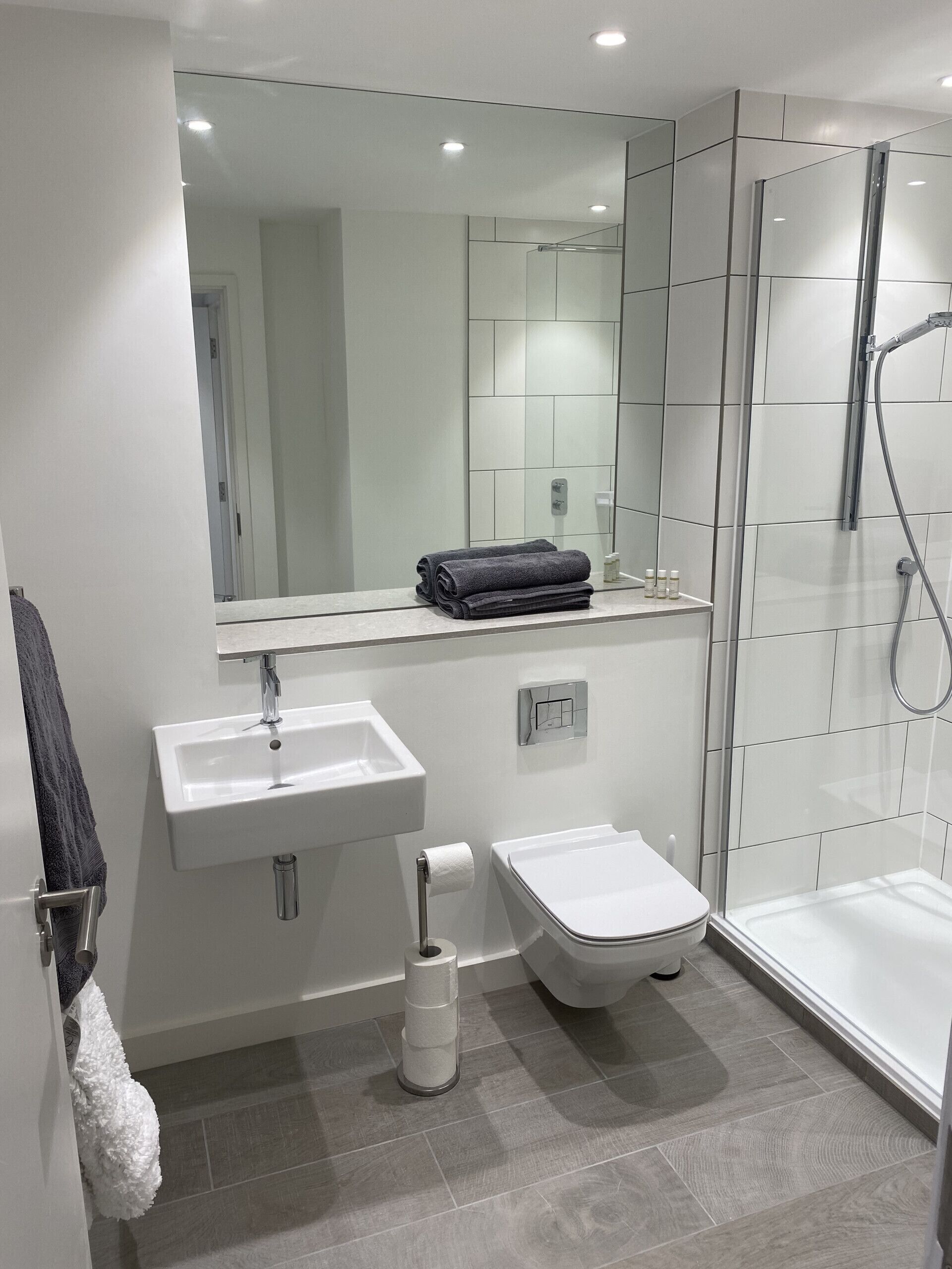 Shower, hair dryer, towels, shampoo