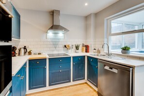 Oven, dishwasher, highchair, cookware/dishes/utensils