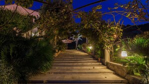 A staircase leading to a building, surrounded by lush greenery and a well-lit pathway. - Cadell Gran - Seven Bedroom Villa, Sleeps 14 (La Puebla)