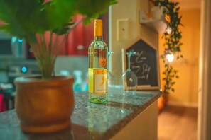 Enjoy casual dining in this kitchen with a chalkboard menu and a touch of greenery.
