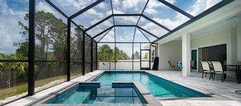 Tropical Oasis with saltwater pool & hot tub on a canal 8 miles from beaches