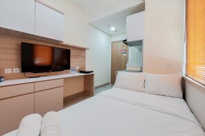 1 bedroom, free WiFi, bed sheets - Comfort and Cozy Studio Apartment at B Residence (Pagedangan)