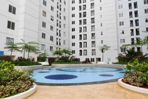 Outdoor pool - Minimalist and Warm 2BR Bassura City Apartment (Jakarta)