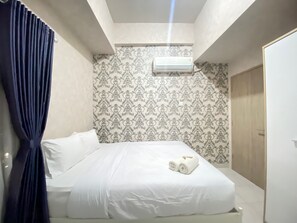Room | 2 bedrooms, free WiFi, bed sheets - Pleasant 2BR Apartment at Newton Residence (Bandung)