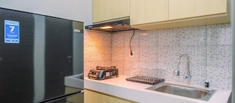 Elegant and Comfort 2BR at Royal Heights Apartment