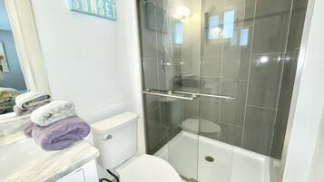 Shower, hair dryer, towels, soap