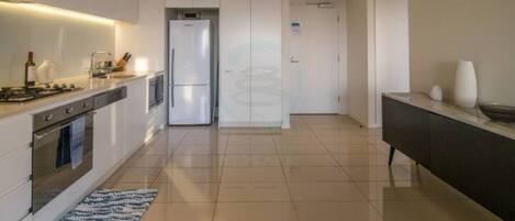 Fridge, coffee/tea maker, high chair, cookware/dishes/utensils