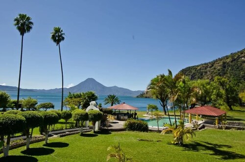 Cozy country cottage with wooden ceilings and stone walls within nature reserve.