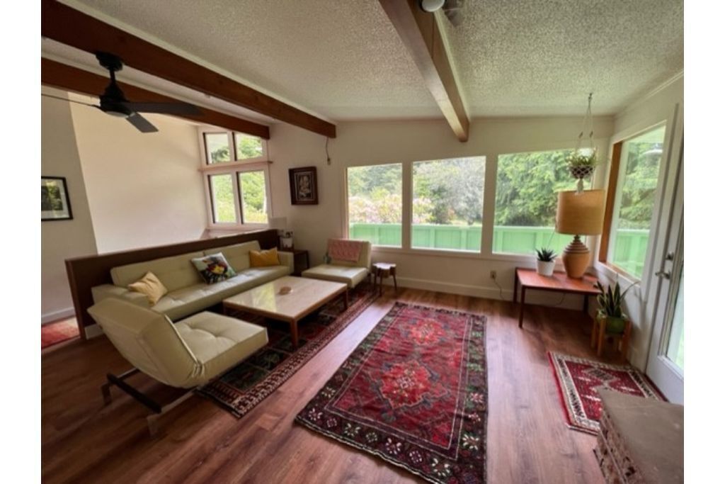 Private mid-century modern hideaway in forest near the river and sea.