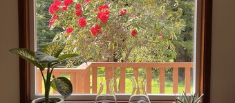 Private mid-century modern hideaway in forest near the river and sea.