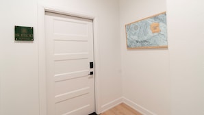 A white door with a sign indicating 'Suite 10 Island Park'.