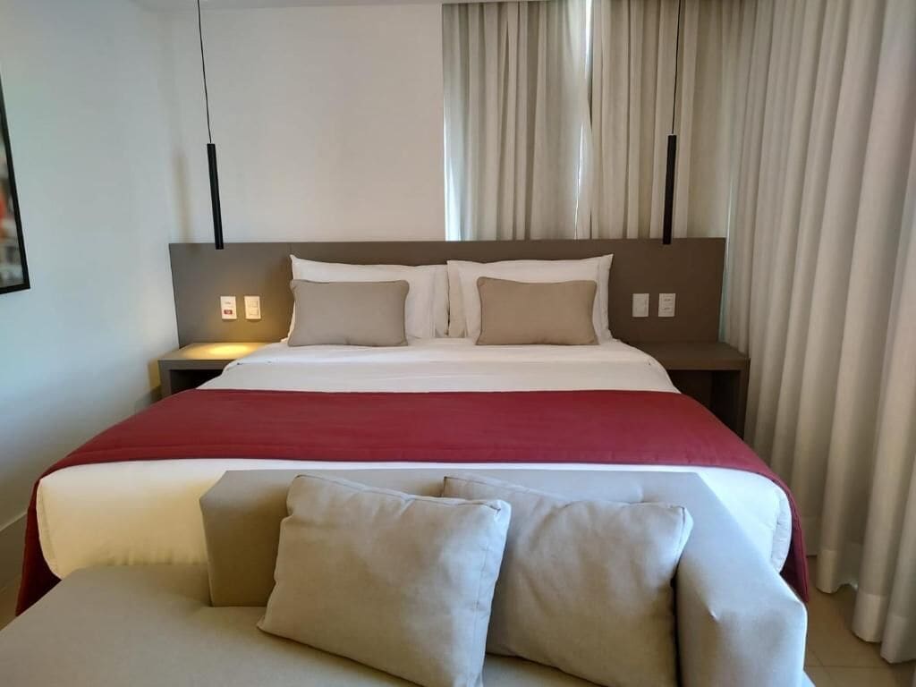 premium room, 1 queen bed, non smoking | minibar, blackout curtains, bed sheets