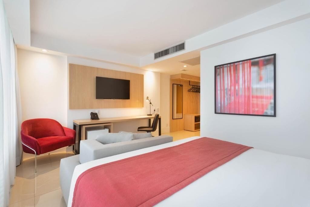 premium room, 1 queen bed, non smoking | minibar, blackout curtains, bed sheets