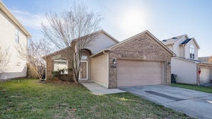 A two-story house with a garage, a front yard, and a brick section. - Lexington Cutie! Entire house close to UK, hospitals,  and Keeneland (Lexington)