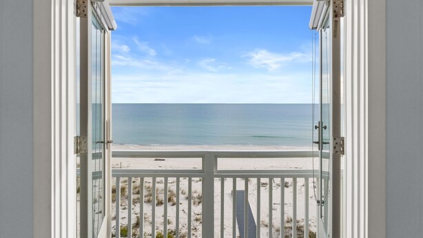 An open door with a view of a beach and ocean. - Sounds of Summer: Beachfront, Sun Deck, Screened Porch (St. George Island)
