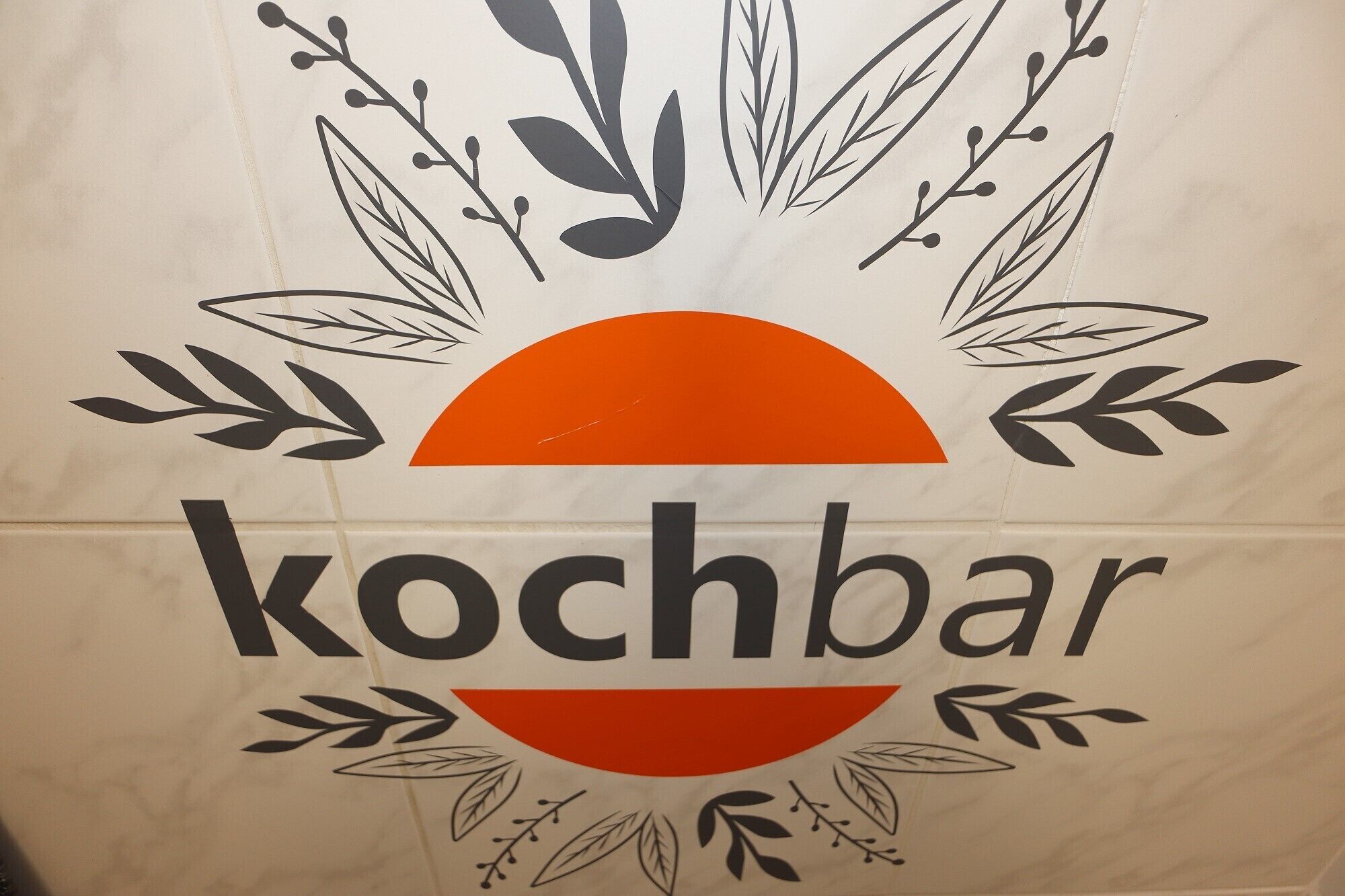 A bag with the word 'kochbar' and a sun graphic.