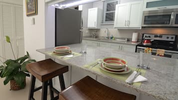 Fridge, microwave, stovetop, coffee/tea maker