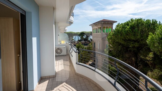 A balcony with a view of a building and trees. - Holiday Rendez Vous 38 - Third floor apartment with pool view (Pineto)