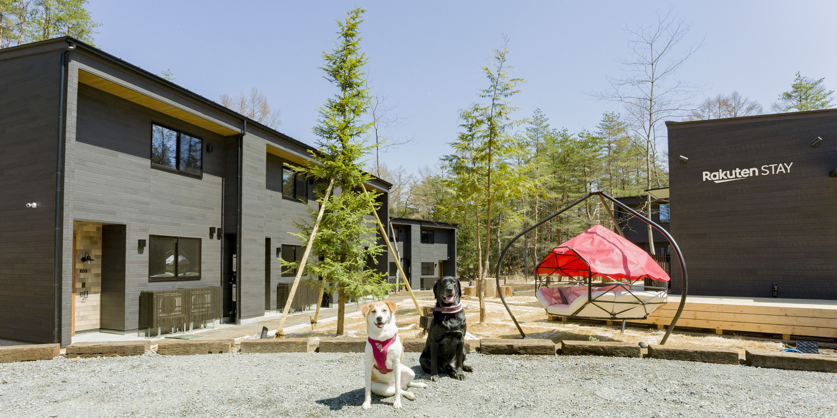 A modern building with a sign reading "Rakuten STAY".
