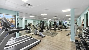 A gym with treadmills, weight machines, and free weights. - Double balcony ocean view condo at Ocean reef resort (Myrtle Beach)