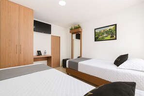 Habitación Deluxe | Ropa de cama de alta calidad, edredón y decoración personalizada