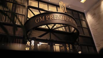 A building with a sign reading "GM PREMIUM".