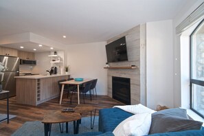 TV, fireplace - Newly renovated Quality 1 bedroom at the Marquise- heated pool, located on Free ski/village shuttle (Whistler)