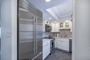 Modern high end kitchen with SubZero refrigerator. Plenty of dishes, glasses, silverware provided. - 8th-Floor Luxury, Panoramic Gulf Views on Siesta (Sarasota)