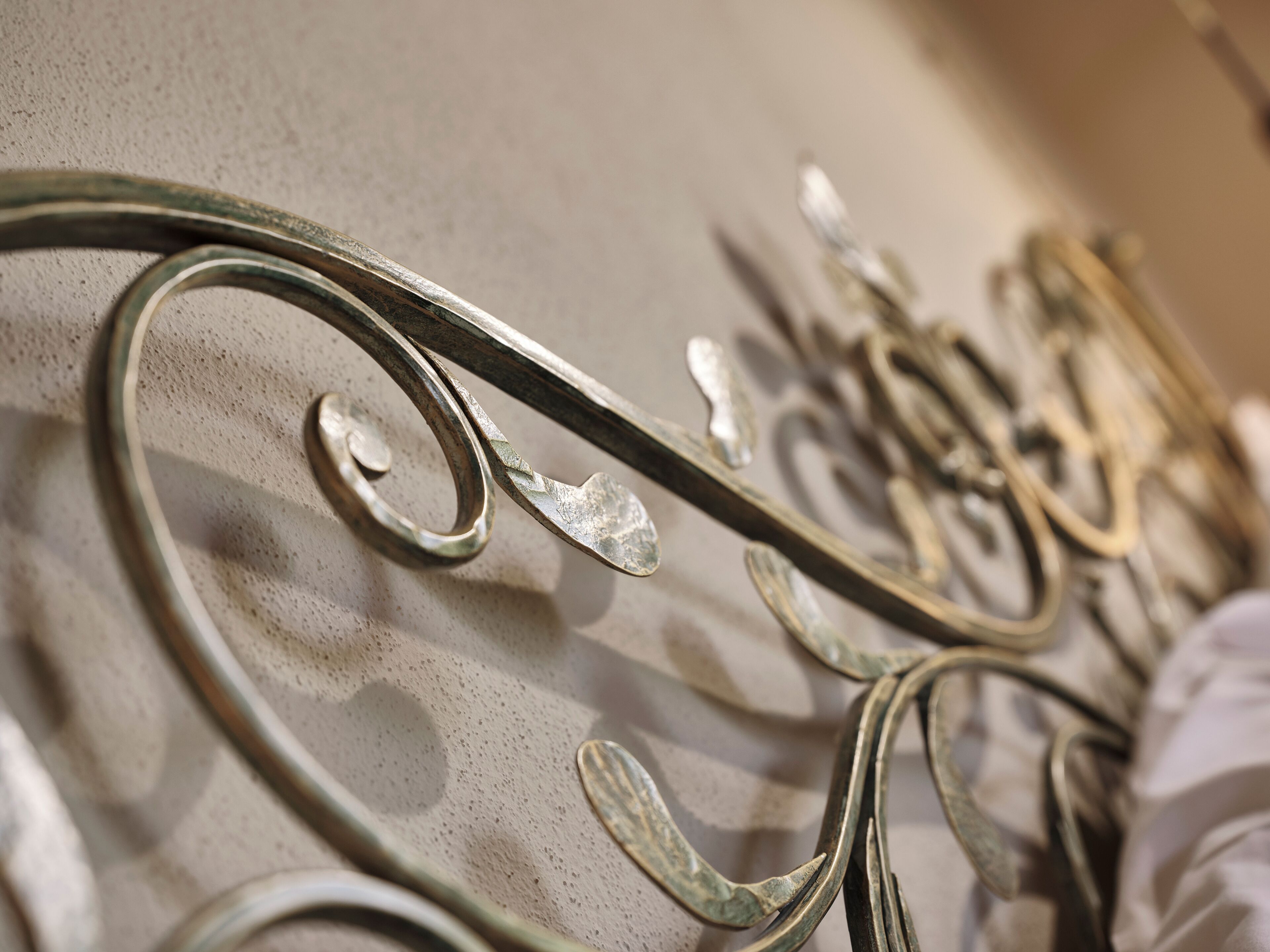 A close-up of metalwork with intricate designs, likely part of a decorative feature or furniture.