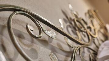 A close-up of metalwork with intricate designs, likely part of a decorative feature or furniture.