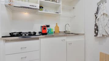 Fridge, microwave, stovetop, coffee/tea maker