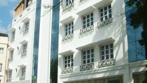A multi-story building with white facades and balconies. - Southern Crest (Chennai)