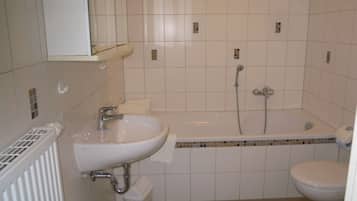 Bathtub, hair dryer, towels