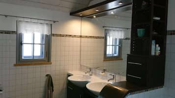 Bathtub, hair dryer, towels