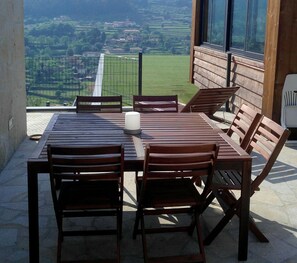 Enjoy a serene view of the surrounding landscape from this outdoor space.