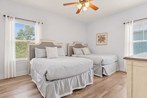 A bedroom with two beds, a ceiling fan, and a window with blinds. - Blue Haven by the Sea - 3BR/2.5BA Blue Mountain Beach - Sleeps 8 - Community Pool (Santa Rosa Beach)