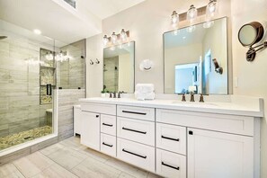 Separate tub and shower, hair dryer, shampoo