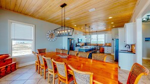 Enjoy family meals in this kitchen with a central island, modern appliances, and ample counter space.