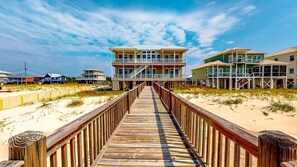 Enjoy stunning ocean views from the balcony of this beachfront property, accessible via a boardwalk.